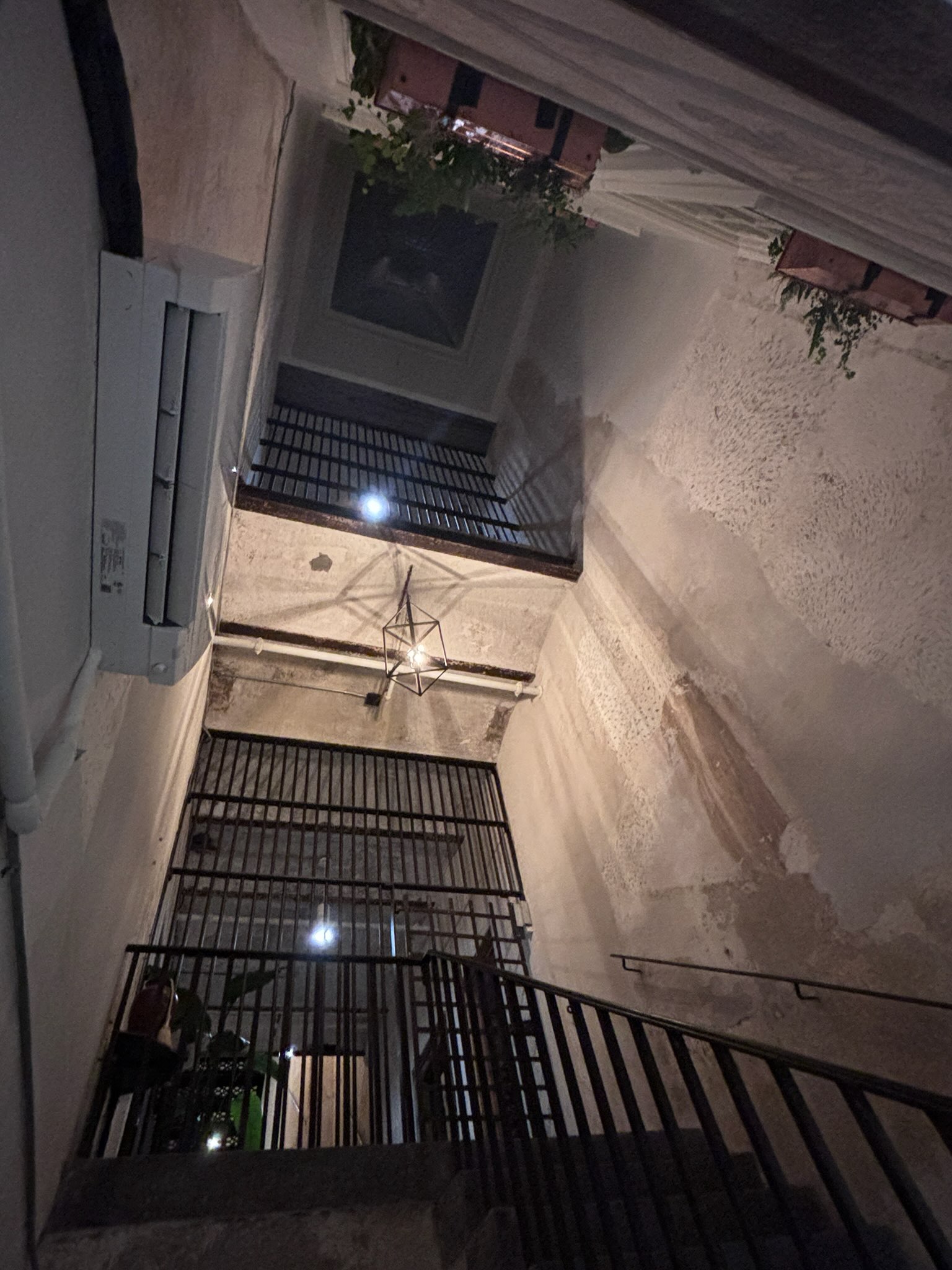 Heading up the exterior staircase towards the jail cells